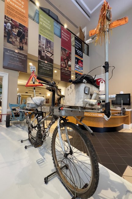 "A Man and His Bike" on display in the lobby of the East Tennessee History Center.